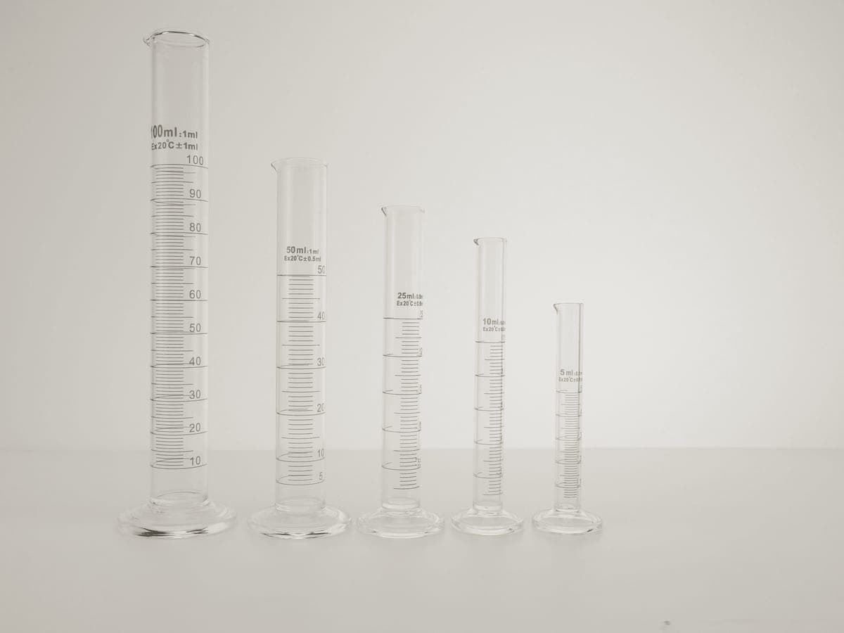 Water being measured into a clear glass vessel